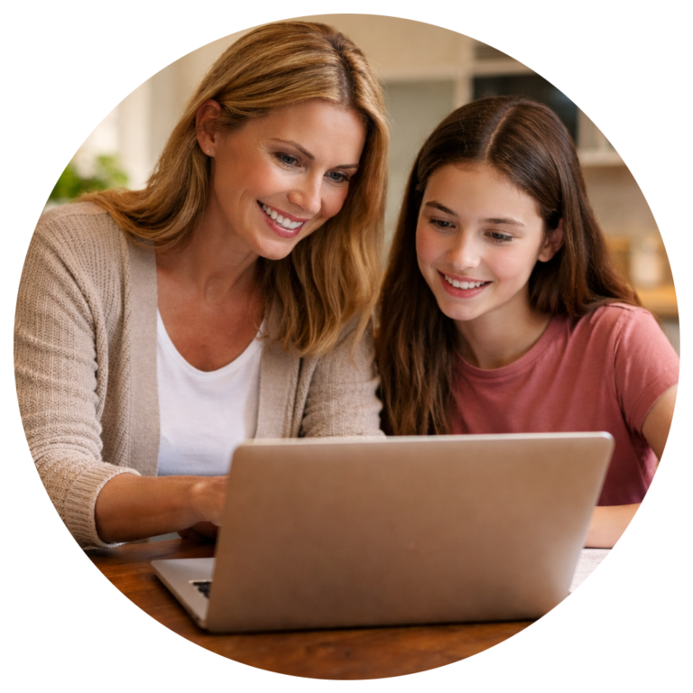 Mother and daughter registering for scholarship updates on a laptop
